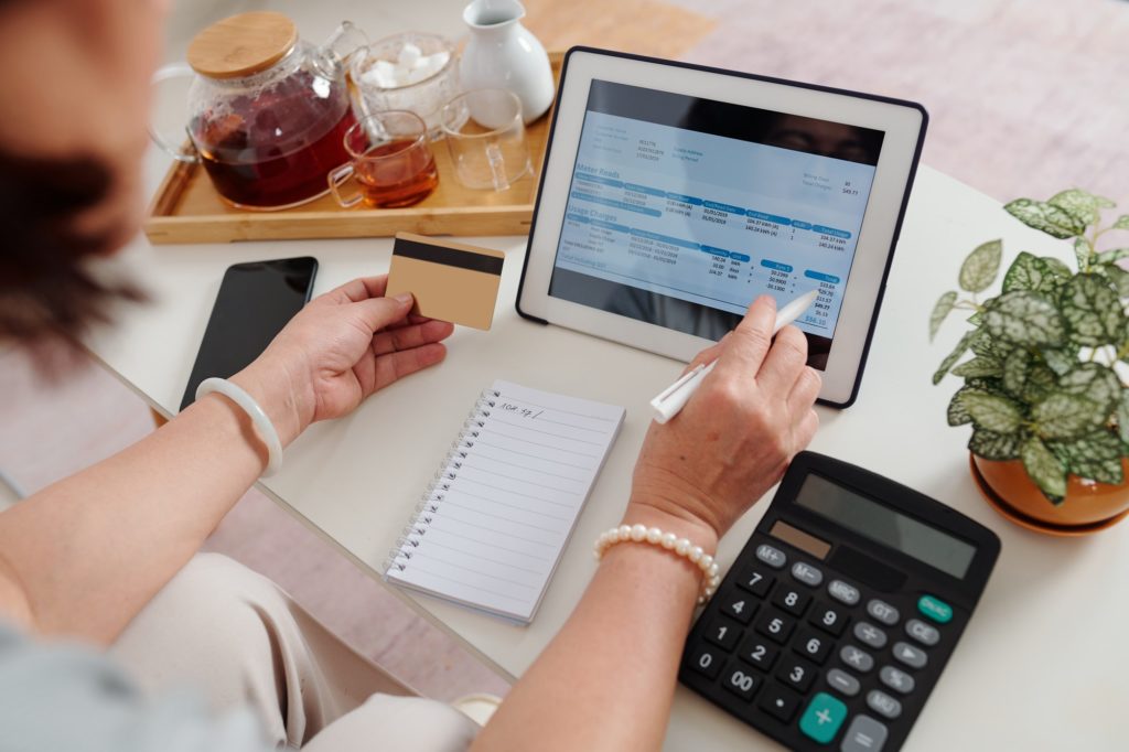 Woman paying utility bills